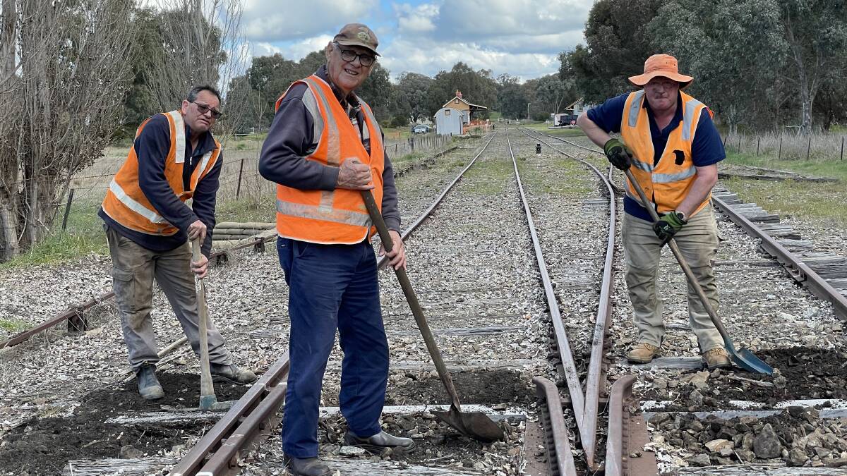WORKS: Ladysmith Tourist Railway treasurer Wally Bell (centre) and members Mark Pottie and Chris Wernert replace sleepers on Saturday. Picture: Rex Martinich