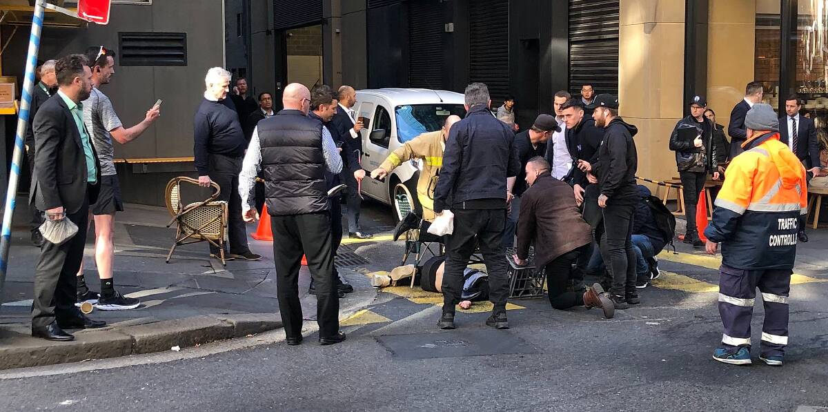 INTERVENTION: Passers-by use chairs and a milk crate to detain Mert Ney in Sydney's CBD on August 13, who was later charged with the murder of Michaela Dunn and the attempted murder of Lin Bo. Picture: AAP 