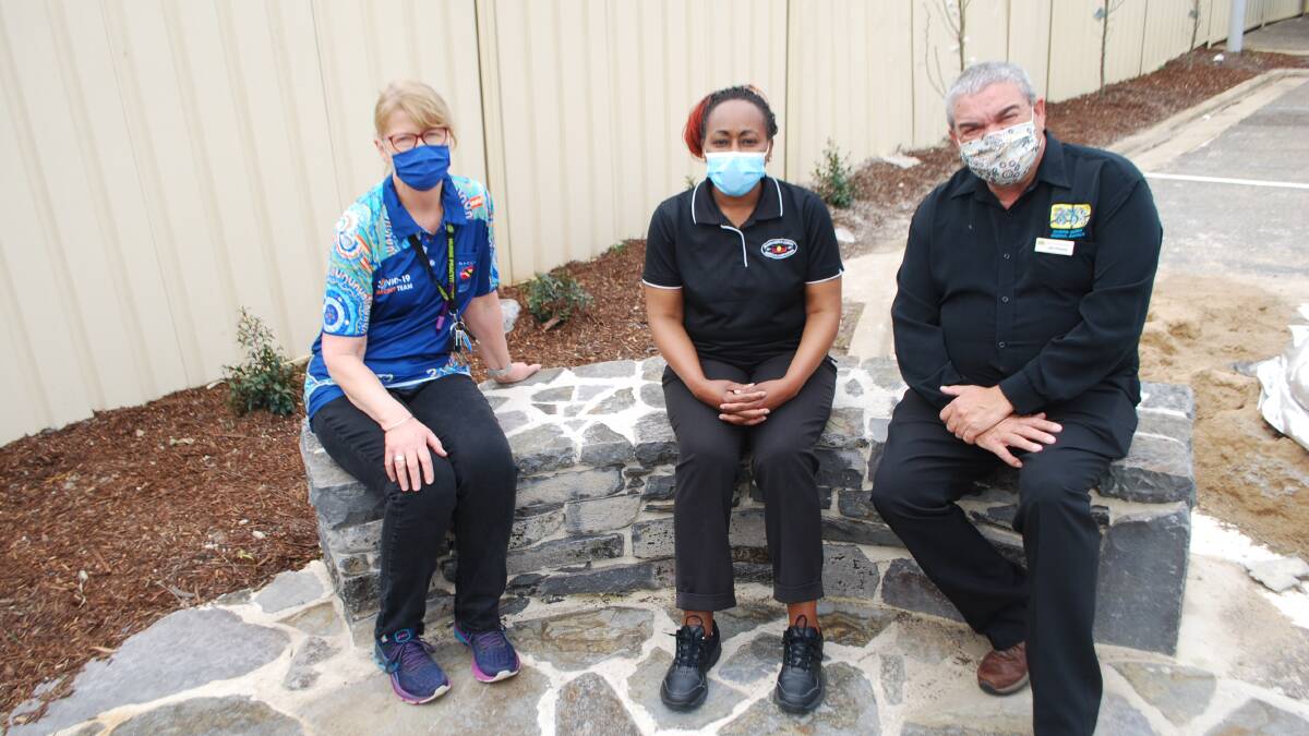 Riverina Medical and Dental Aboriginal Corporation nurse practitioner immuniser Leigh Spokes, nurse immuniser and practice nurse Dorcas Musyimi and chairman John Fernando at the Yarning Circle - a place where they meet and have a chat - at the corporation's Docker Street building. Picture: Sean Cunningham.