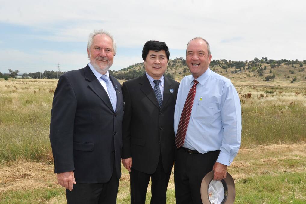 Wuai Group representative Zhaoxiang Jin checks out the Copland Road site for the new trade centre with member for Wagga Daryl Maguire and Wagga mayor Rod Kendall in 2013
