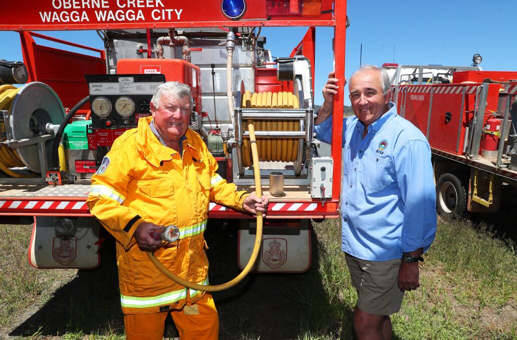 DECADES OF SERVICE: Oberne Creek Rural Fire Service Brigade members Glenn Lucas and Jon Morgan are part of the 'oldest fire brigade in Australia', with most volunteers serving for 50 years or more. Picture: Emma Hillier