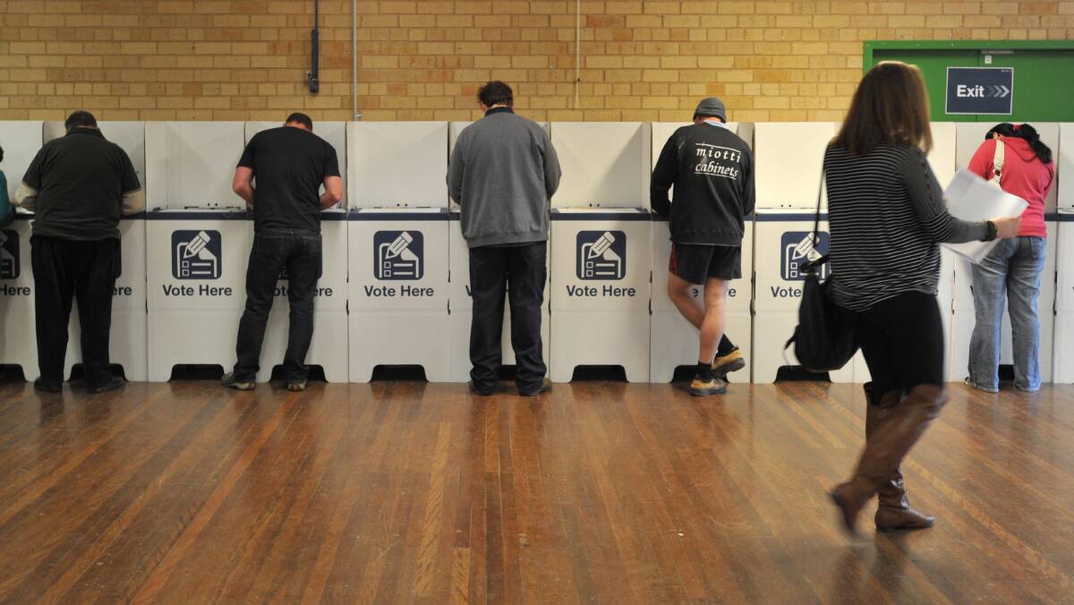 Voting in the Wagga City Council election at Lake Albert Public school in 2012.