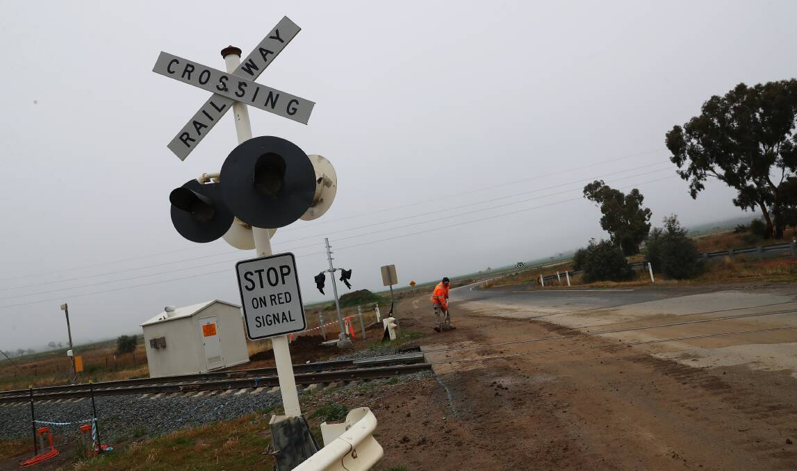 The start of works in late June to replace lights and install boom gates at Harefield Road level crossing between Wagga and Junee. Picture: Emma Hillier. 