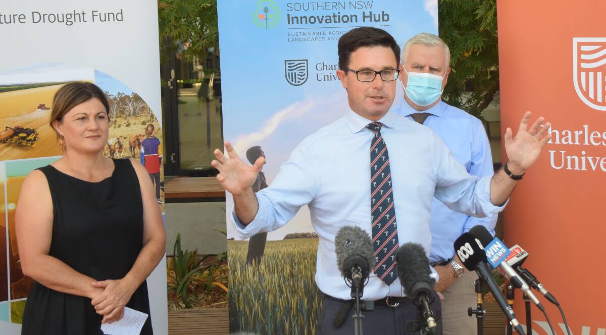 DIVIDEND: Southern NSW Innovation Hub director Cindy Cassidy, federal Agriculture Minister David Littleproud (Centre) and Riverina MP Michael McCormack andat the announcement of funding. Picture: Rex Martinich