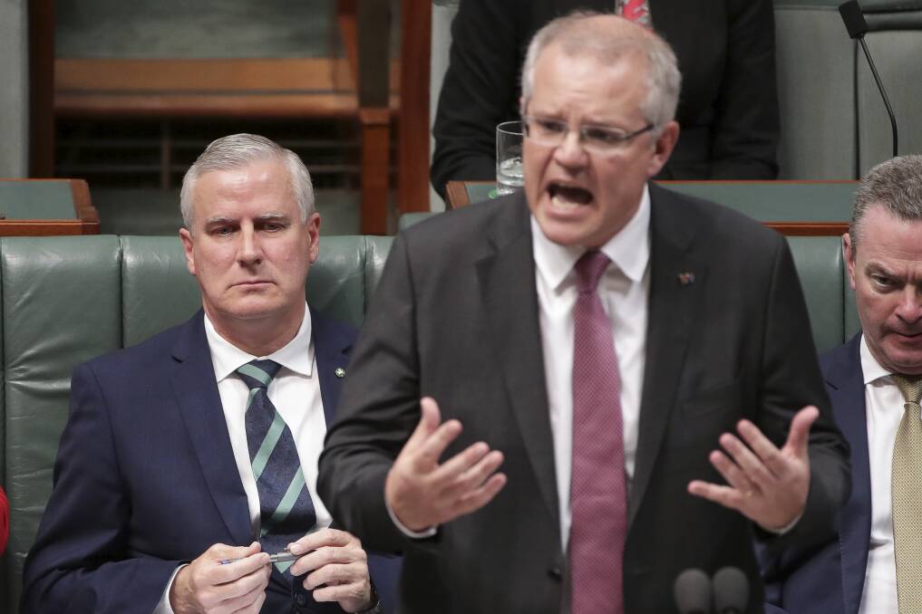 Riverina MP and Deputy Prime Minister Michael McCormack and Prime Minister Scott Morrison in Parliament on Thursday. Picture: Alex Ellinghausen