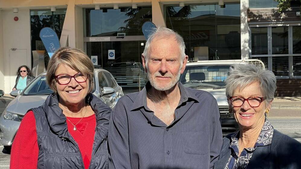 Book Book cattle, sheep and grain farmer Melody McMeekin, and Coreinbob landowners Rick and Pam Martin, outside a meeting in Wagga in April over the $2.1 billion HumeLink power line project. Picture: Rex Martinich