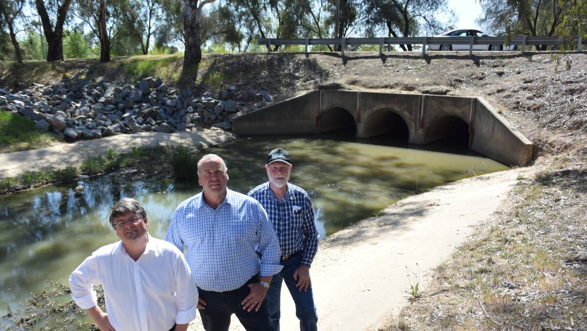 LAKE PLAN: Wagga council general manager Peter Thompson, Cr Paul Funnell and Lake Albert Forum member Gary Williams at Tatton Drain in 2018, which was part of a stalled plan to improve the lake's water quality.