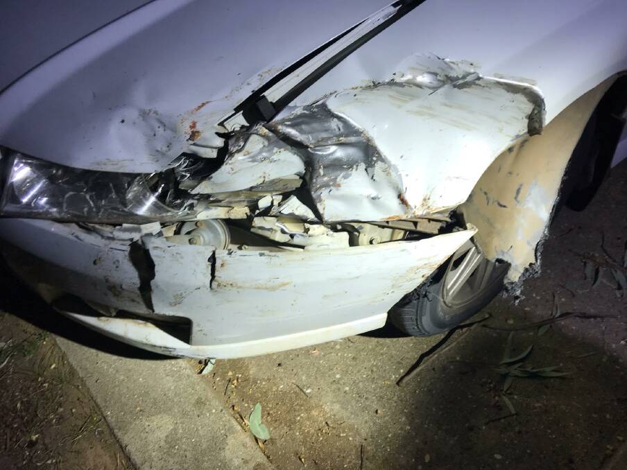 Collision damage on the front of a white Holden VZ Commodore sedan that was involved in a police pursuit in Wagga early on Friday morning. Picture: Supplied.