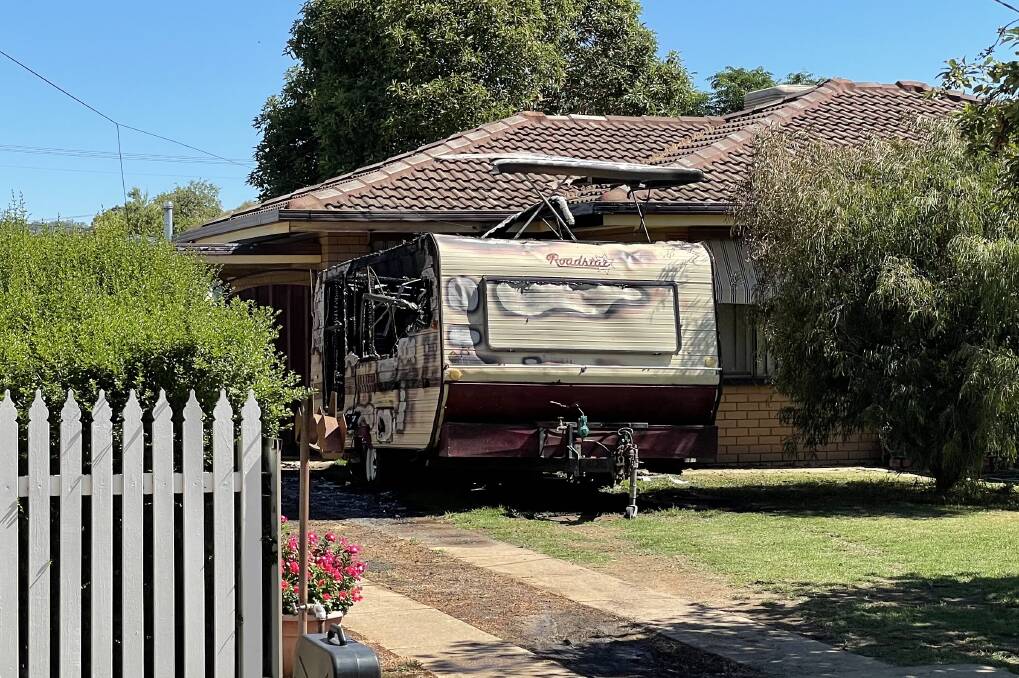 A caravan that was destroyed by fire on Fernleigh Road in Ashmont on Sunday afternoon. Picture: Rex Martinich