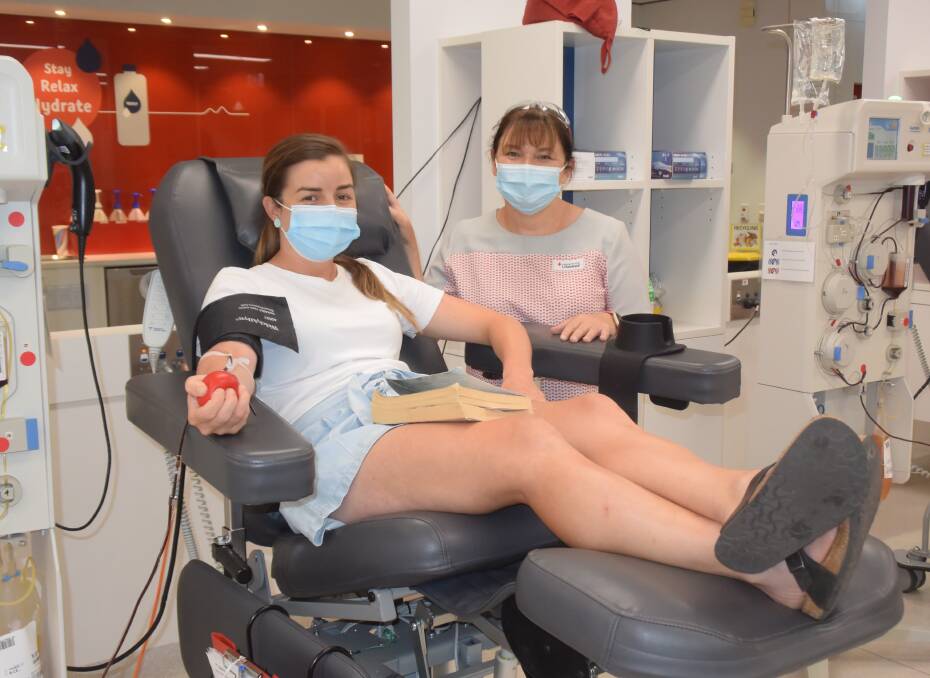 GIFT: Meg Davies, from Wagga, makes her 59th blood and plasma donation at Wagga Donor Centre on Tuesday, with session leader Melissa Galvin. The Red Cross is looking for hundreds of new donors. Picture: Rex Martinich