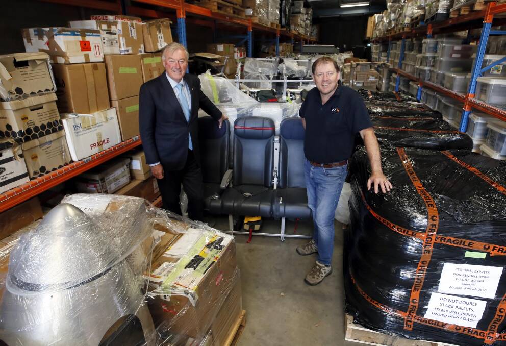 STORAGE: Regional Express deputy chairman John Sharp and engineering adviser to the chairman's office, Dale Hall, at the airline's current Wagga warehouse, which will be replaced with a new $1 million national storage centre. Picture: Les Smith