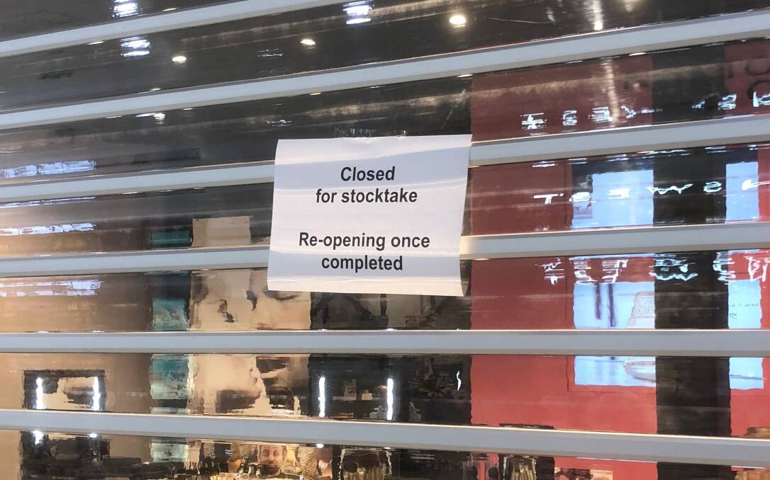 A sign posted outside Wagga’s Napoleon Perdis make-up store after the chain went into administration on Thursday.