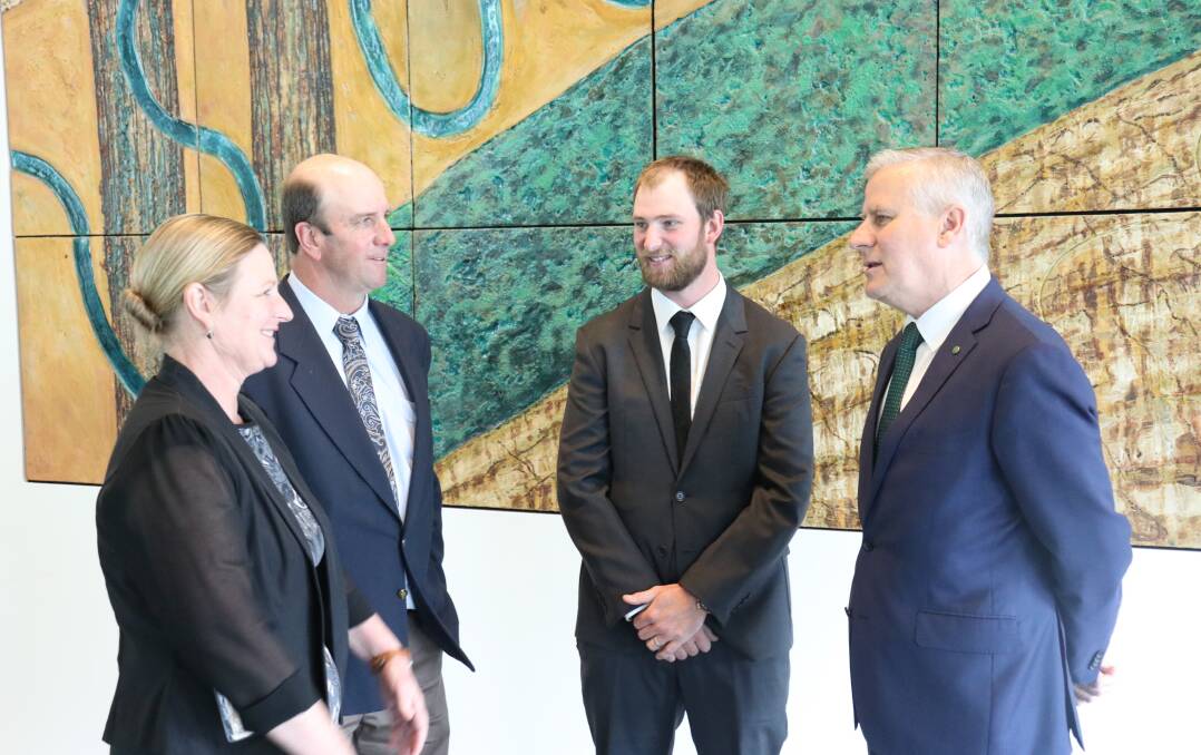 AWARD: Marrar farmer Dan Fox at Parliament House in Canberra with his parents Cath and David and Riverina MP Michael McCormack (right). Picture: Contributed