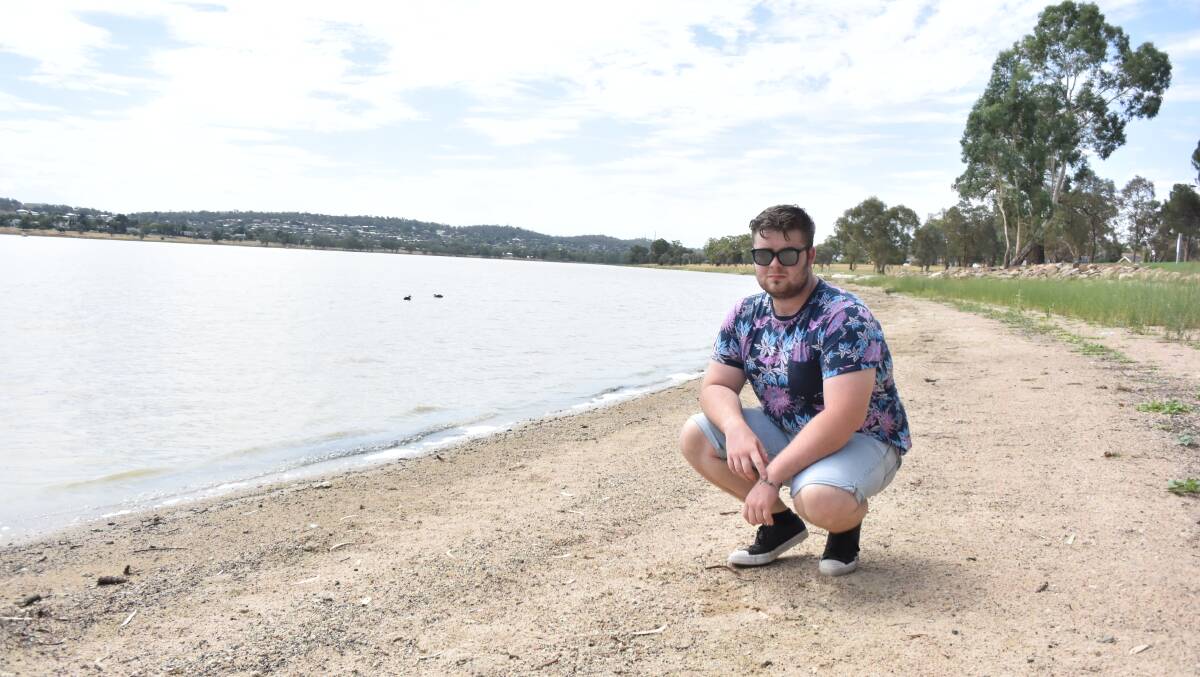 WATER FIGHT: Wagga resident Jacob O'Hare next to Lake Albert, a place that he loved visiting as her grew up but has been plagued by Blue Green Algae, odours and low water levels. Picture: Rex Martinich