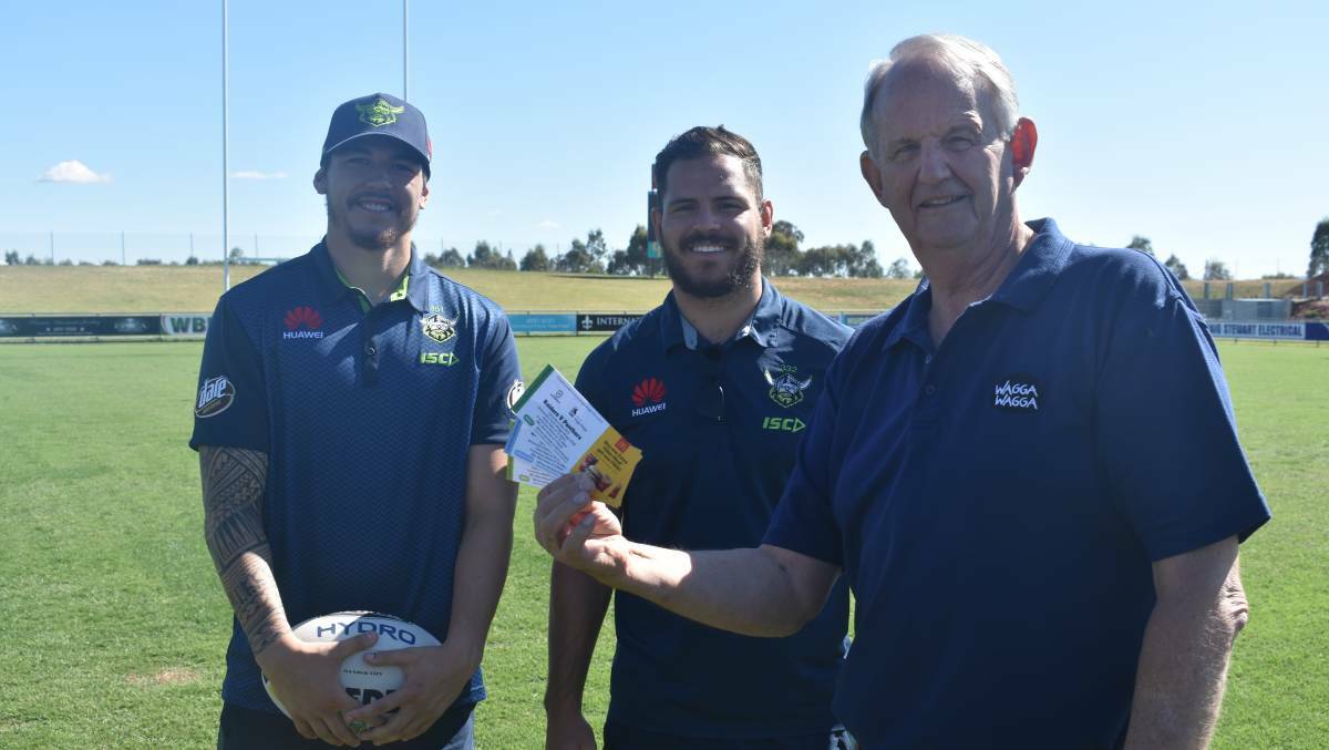 UP FOR GRABS: Canberra Raiders players Brad Abbey and Aidan Sezer with Wagga mayor Greg Conkey at Equex Centre in November. Picture: Courtney Rees