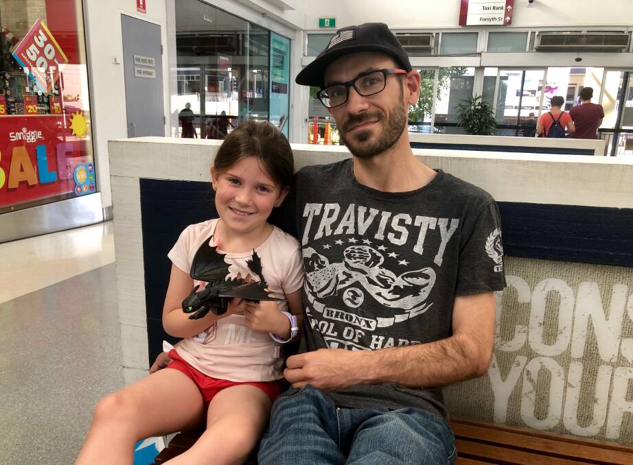 KEEN SHOPPERS: Garrett Lane and his eight-year-old daughter, Ivy, visits Sturt Mall to gain some major discounts on Boxing Day. Picture: Toby Vue