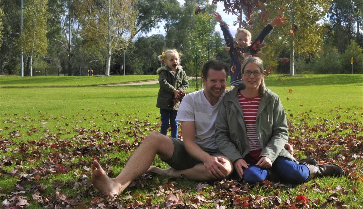 PLAY TIME: Wagga residents Nathan and Sarah Gregor with their son, Thomas (5), and daughter, Hannah (3) enjoying the sun at Victory Memorial Gardens.