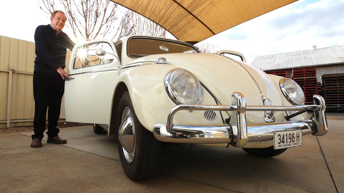 PRISTINE: Mr Dicker's 'arctic white' car is his second since 1960. It has less than 60,000km. The bumper bars and hubcaps are the only items slightly modified. Picture: Les Smith
