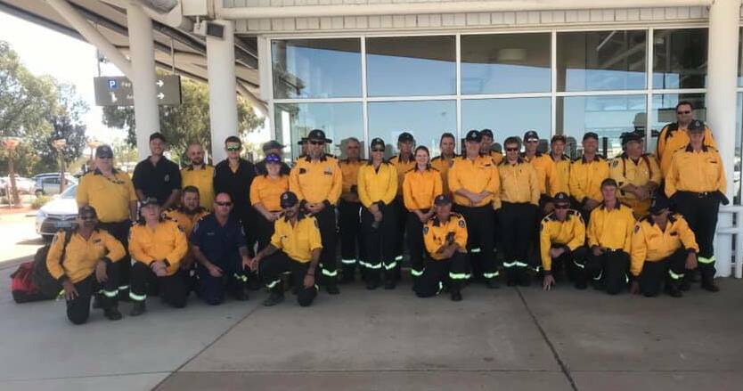READY TO HELP: The 33 NSW RFS members from the southern region before their flight to Queensland. Picture: Supplied