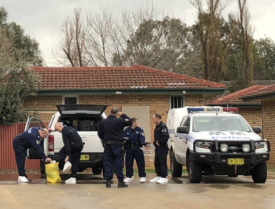 INVESTIGATION: Wagga police officers established a crime scene outside the Ashmont unit where the stabbing happened in late August last year.