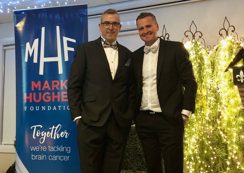 WORKING TOGETHER: Geoff Reid, a brain cancer patient in Wagga, with former Newcastle Knights' player Mark Hughes at the Gray Tie Ball in June this year. Picture: Cathy Reid