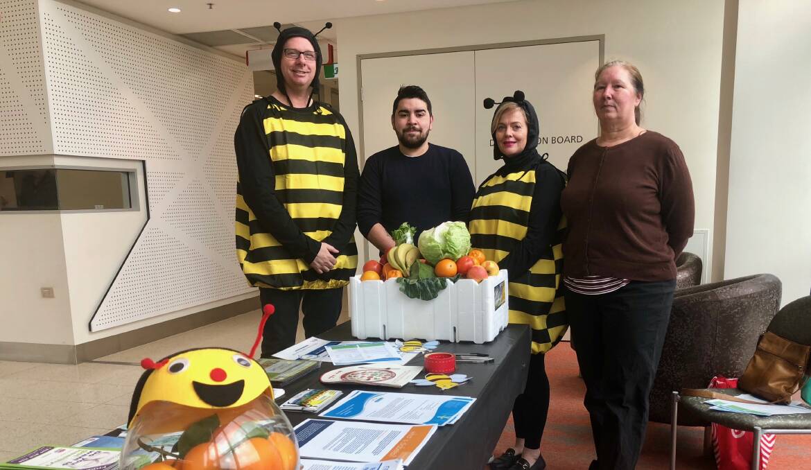 RAISING AWARENESS: Credentialed diabetes educators Jodie Godfrey and Mark Taylor (in outfits) with hospital staff Jordan Ingram and Rebecca Matuski, who both have type 1 diabetes. Picture: Toby Vue