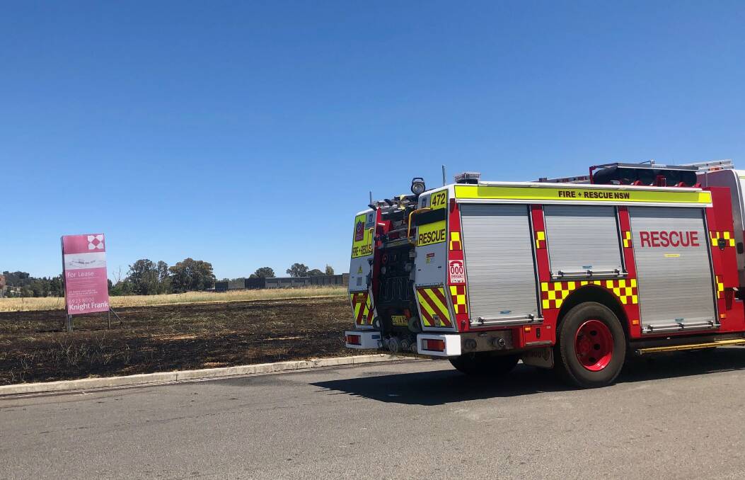 CONTAINED: Firefighters' quick response ensured the the grass fire on Copland Street was quickly managed. Picture: Toby Vue