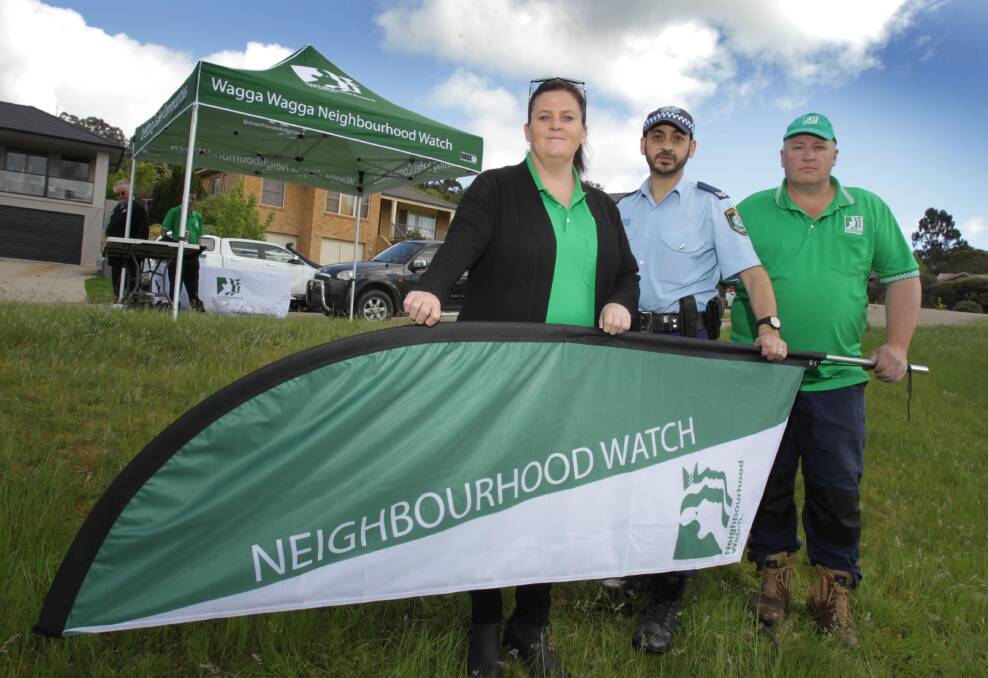 Wagga Neighbourhood Watch treasurer Nicole Eggleton, crime prevention officer senior constable Peter Narouz and Neighbourhood Watch president Wayne Deaner in 2016. Picture: Les Smith 
