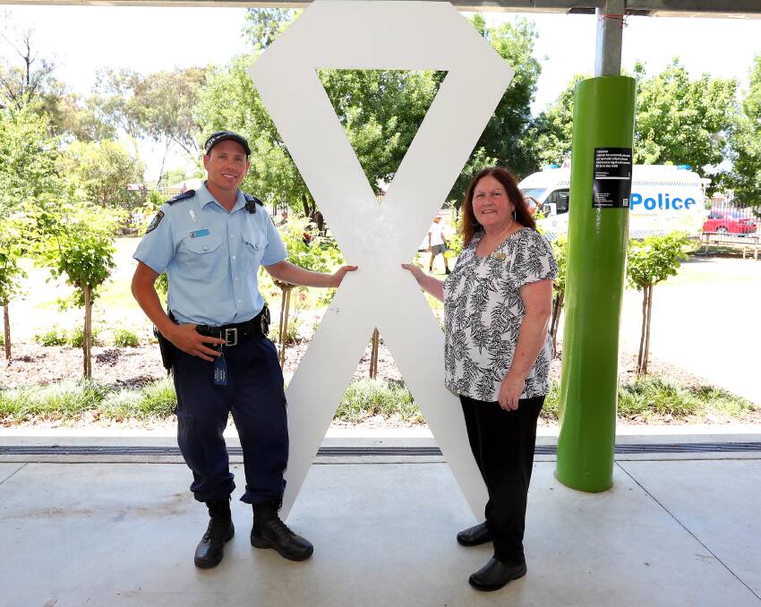 ENDING VIOLENCE: White Ribbon Day at Mount Austin Public School in 2017. Domestic Violence Liaison Officer Lee Matthews with Betty Egan - Southern Region Domestic Violence Coordinator.