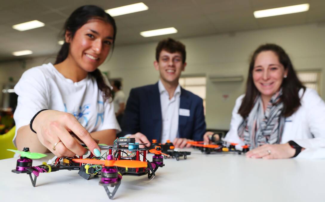DRONE DAY: Mahla Kafami and Sam Lewinson from JAR Education and Jenny Watt, Kildare Catholic College teacher, at a Wagga drone-building workshop in July. Picture: Emma Hillier