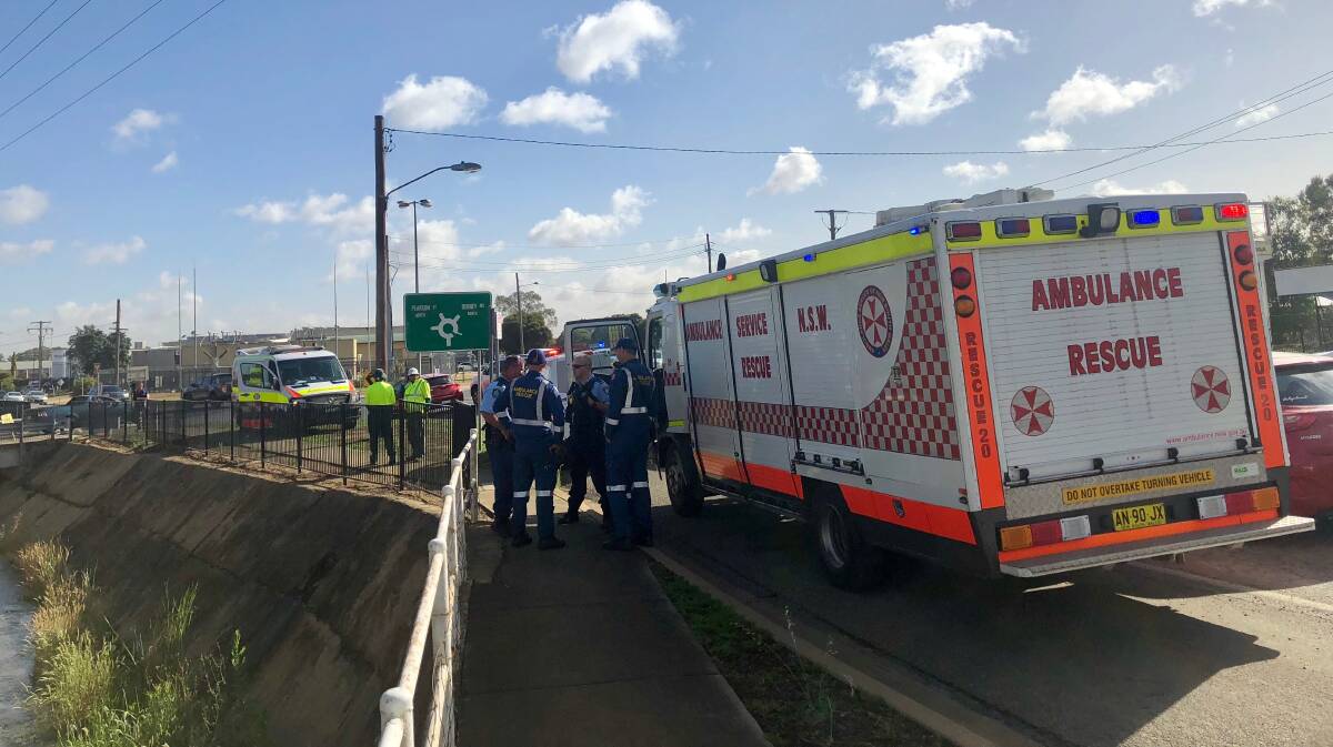 BUSY MORNING: Emergency services at the scene where a teenager fell into storm-water drain in Ashmont. Picture: Toby Vue