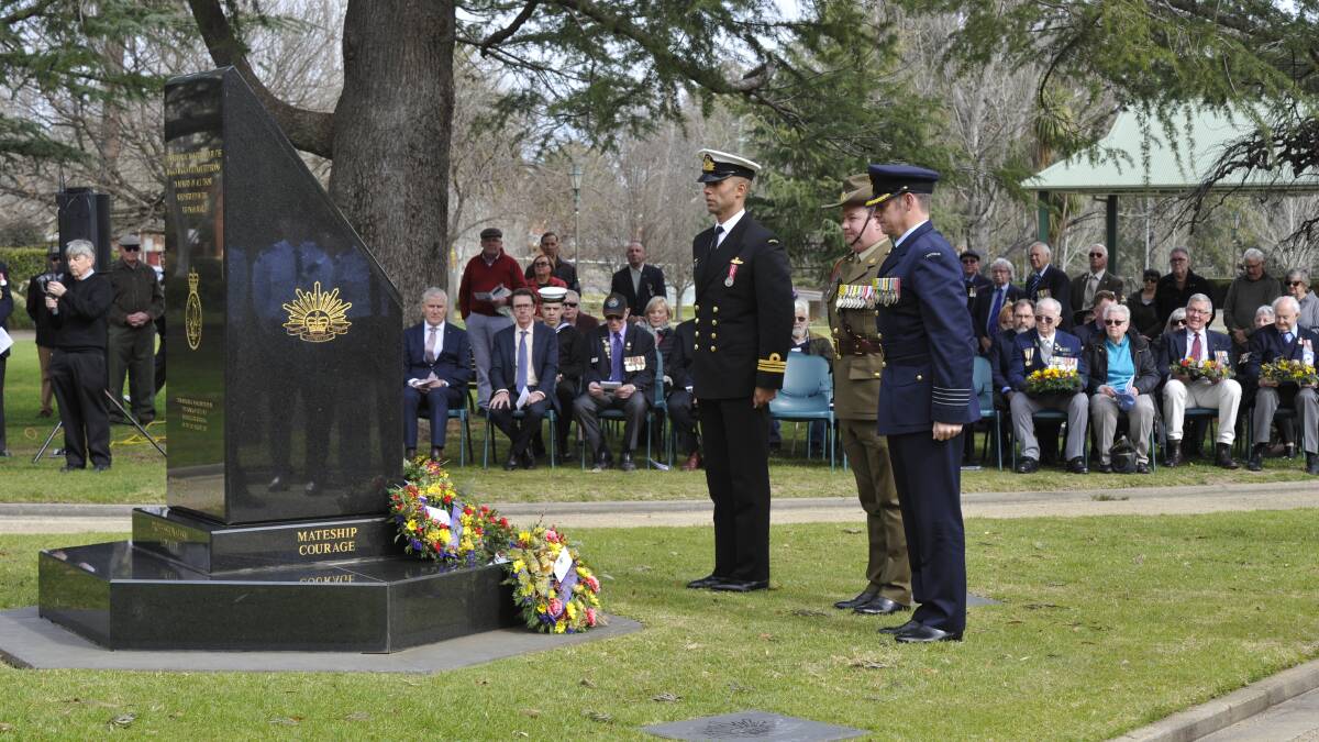 HONOURING: Veterans, political figures and the community came together at Victory Memorial Gardens today to mark Vietnam Veterans Day. Picture: Toby Vue