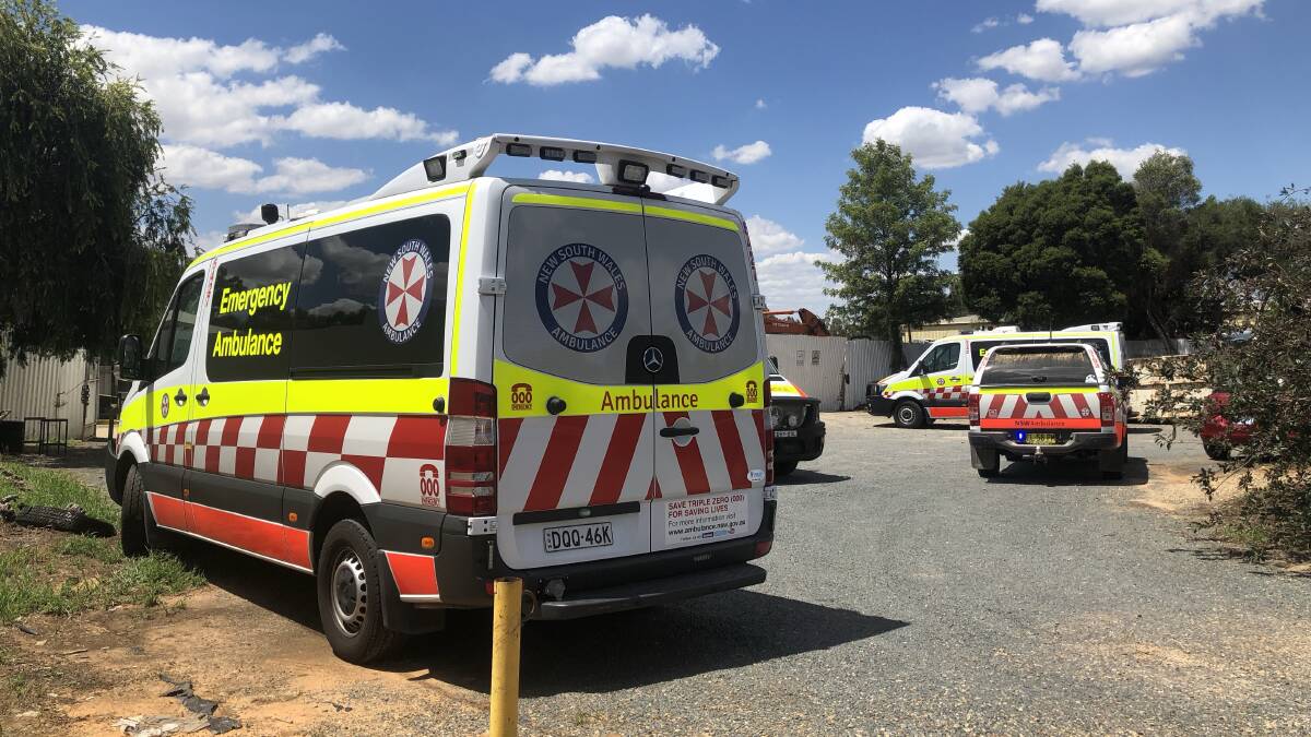EMERGENCY: NSW Ambulance at the Wagga wreckers on Fernleigh Road, Glenfield, yesterday afternoon during reports that a car fell onto two men. Picture: Toby Vue