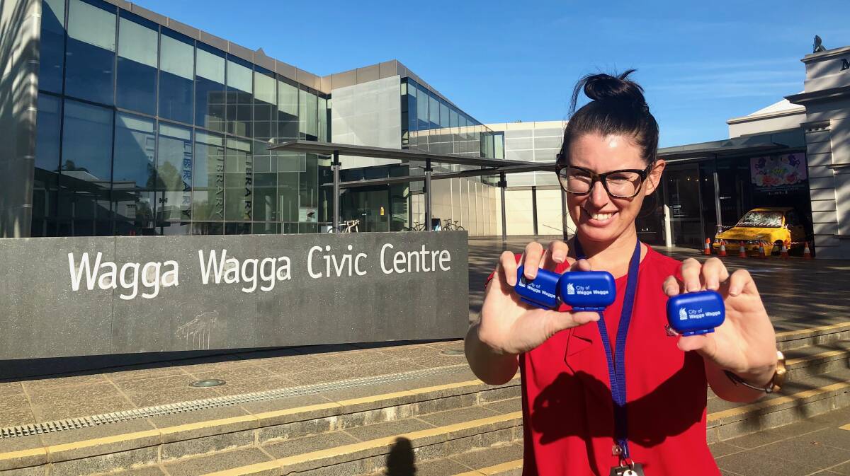 BOOST TO HEALTH: Wagga City Council's environment education officer Sam Pascall with a few of the fitness pedometers on offer for residents. Picture: Toby Vue