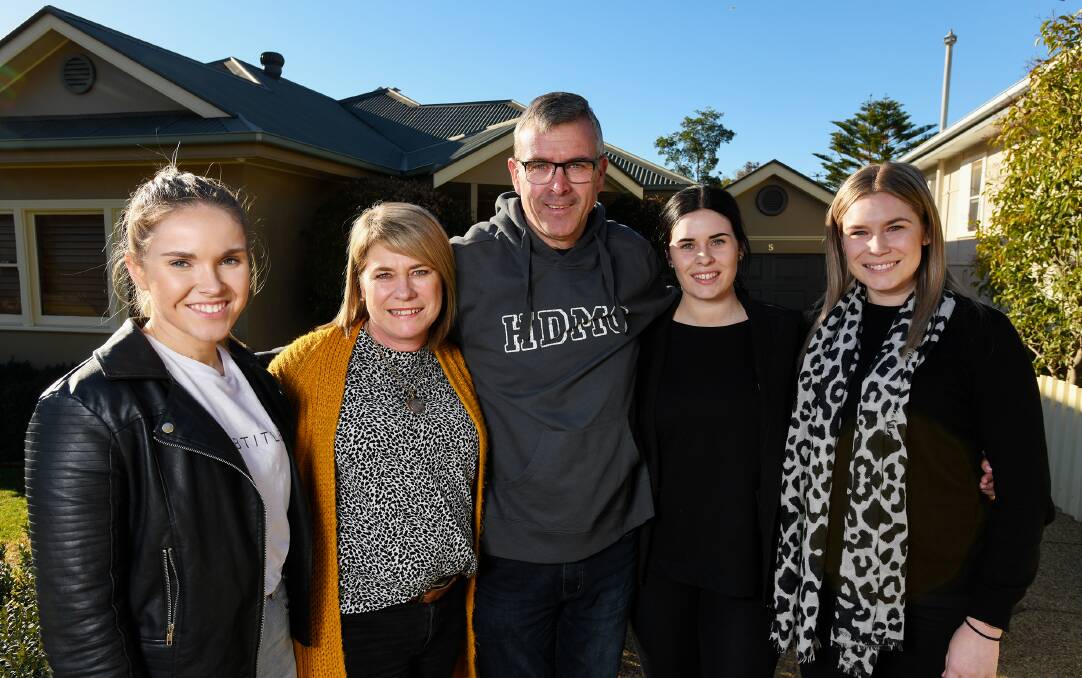 SHOW OF STRENGTH: Geoff Reid with wife, Cathy, and their daughters - Alyce, Maddie and Laura - at their family home in Wagga.