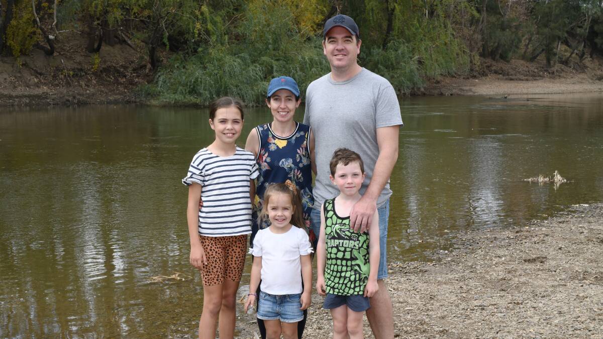 SAFETY FIRST: Tim Parkhurst with his wife, Melissa, and children — Sandie, 10, Rosie, 4, and Leo, 6 — at Wagga Beach on Sunday. Mr Parkhurst says people cannot afford to be complacent about safety around waterways.