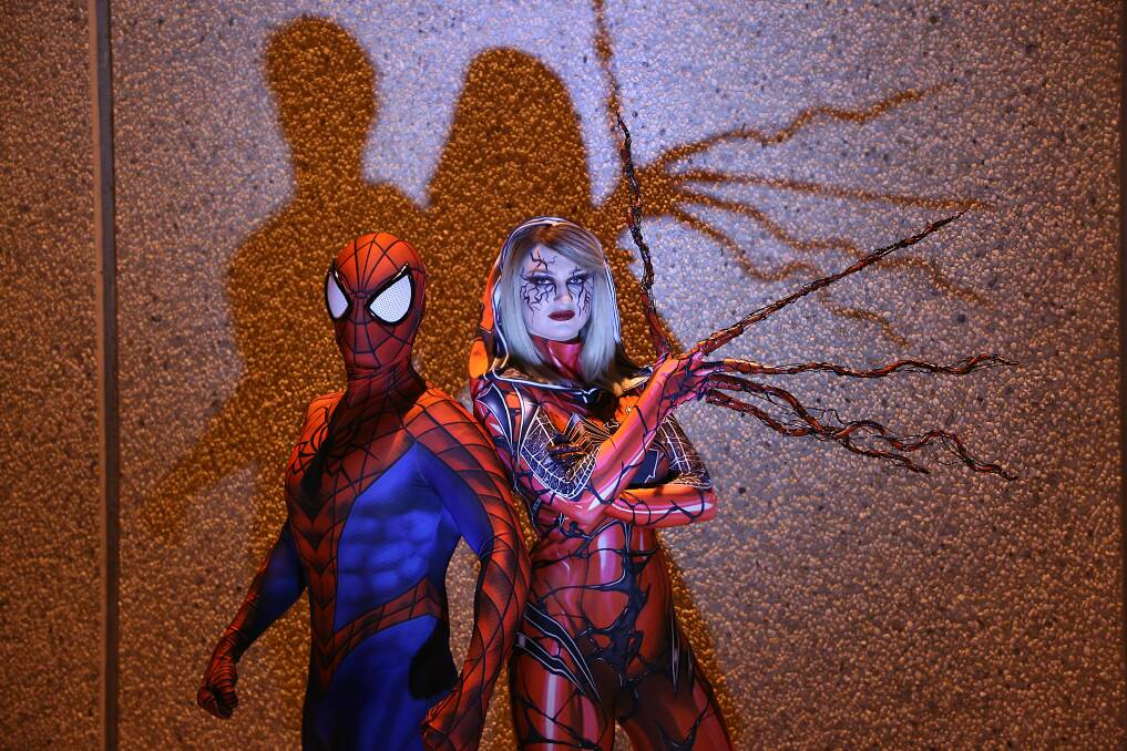 FANS: Isabella Hurst cosplays as Carnage-Gwen and Scott Bullock as Spider-Man. Picture: Supplied
