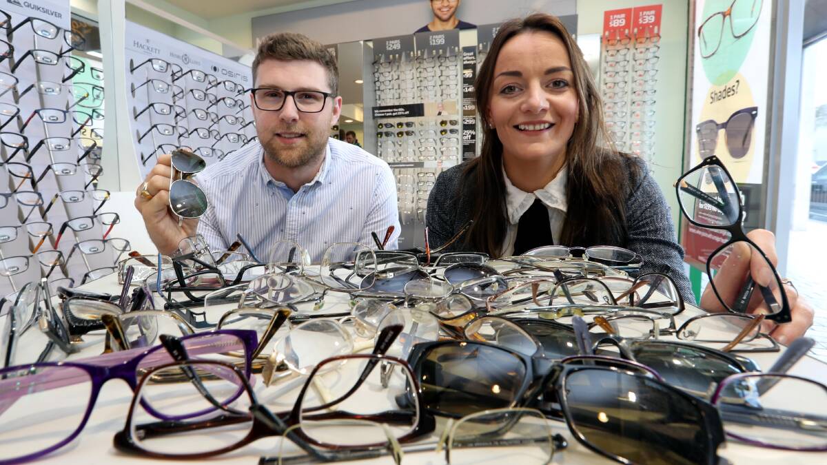 MAKING A DIFFERENCE: Specsavers Wagga co-owners Richard Skidmore and Anne Mill with just a few of the specs already donated.