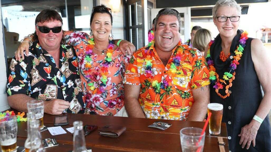 Jamie Campton, Debbie Jenkins, Rob Meyers, and Di Hartley from Collingullie looking very tropical at Wagga Boat Club during the 2017 Skyworks. Picture: Les Smith