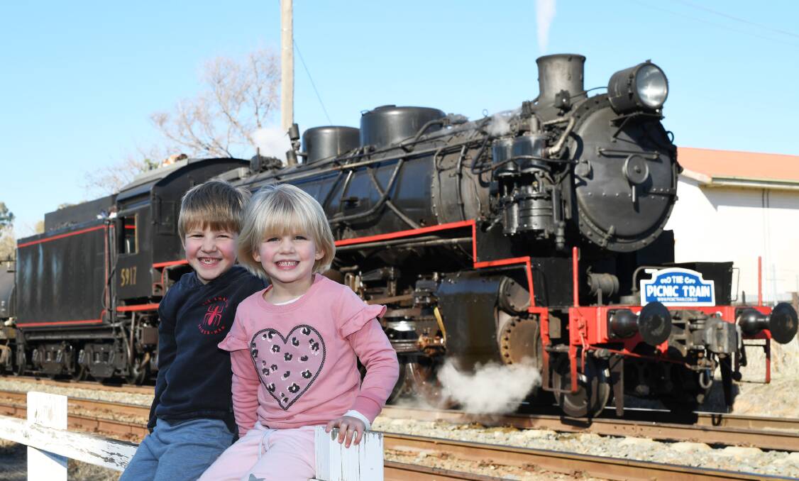 BIG SMILES: Owen Paull, 7, and Maev Paull, 5, were all smiles and in awe of the Picnic Train that came into Wagga Railway Station on Sunday.
