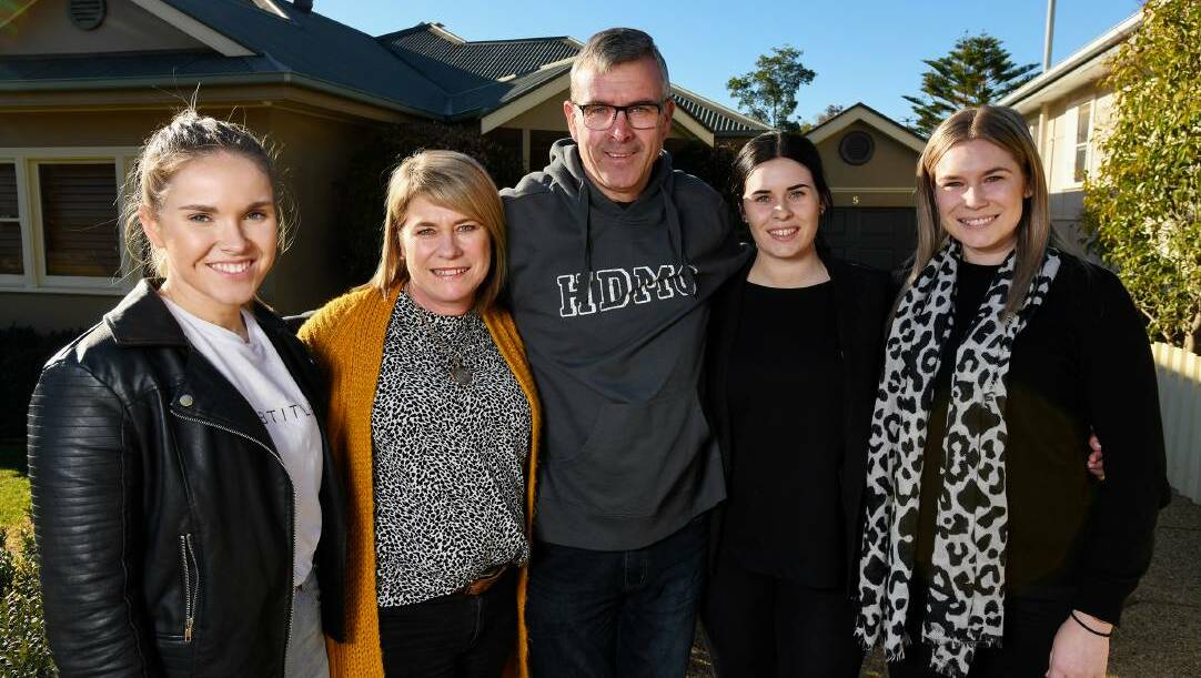 SHOW OF STRENGTH: Geoff Reid with wife, Cathy, and their daughters - Alyce, Maddie and Laura - at their family home in Wagga.