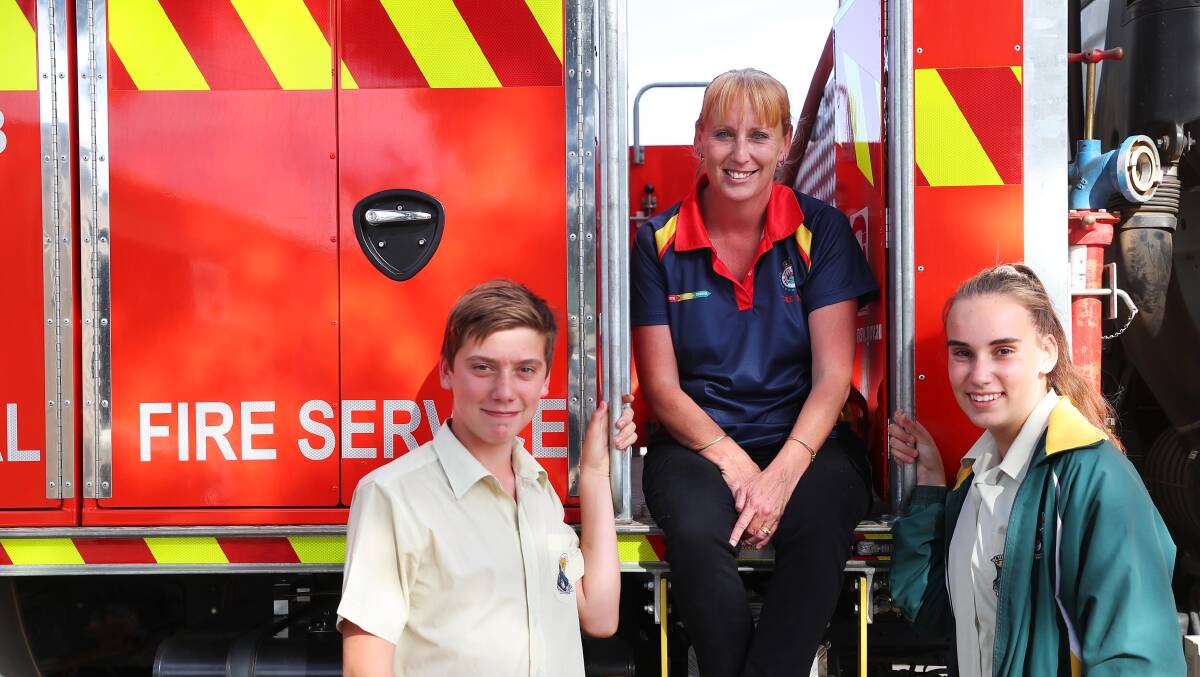 FAMILY EFFORT: The Rock's firefighter Petrina O'Connor (centre) with her children — Aaron, 12, and Georgia, 15. Picture: Emma Hillier