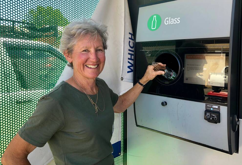 RECYCLING: Wagga resident Julie Willis using the Return and Earn deposit machine at central Woolworths for the first time. Picture: Toby Vue