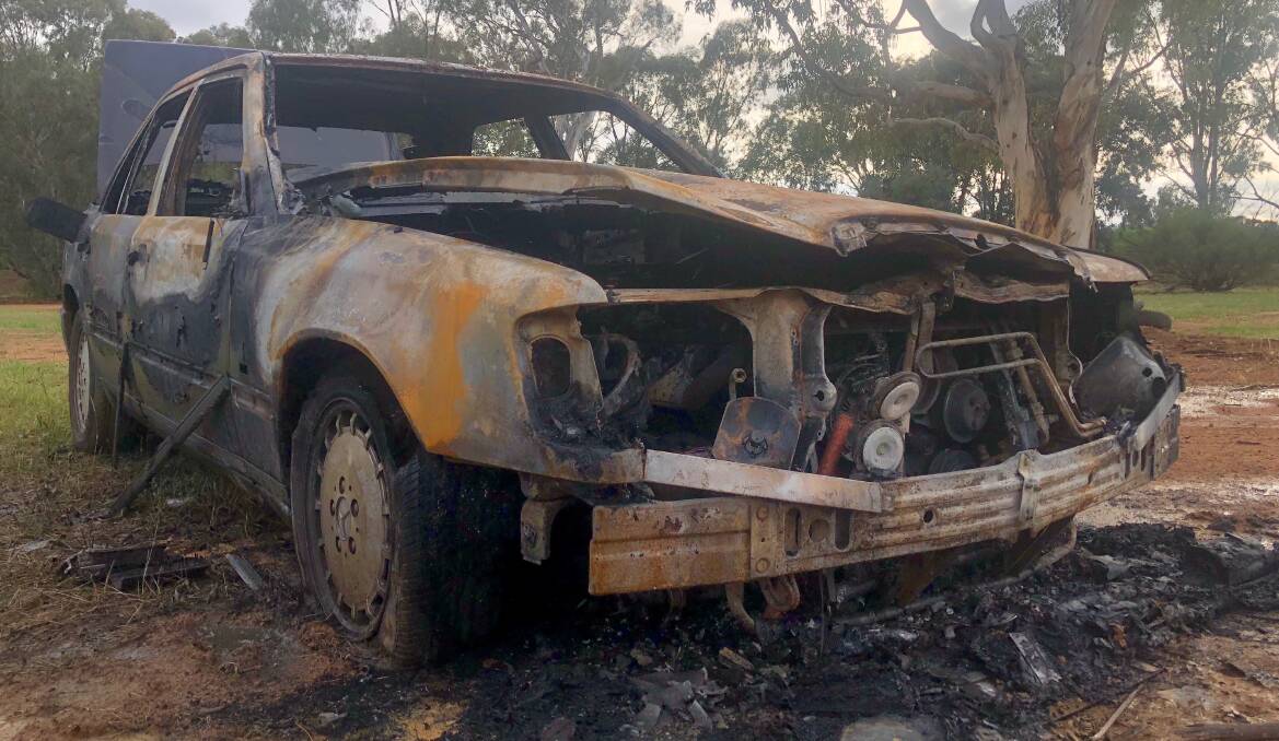 The Mercedes sedan destroyed in another suspicious fire at Mt Austin. Picture: Toby Vue