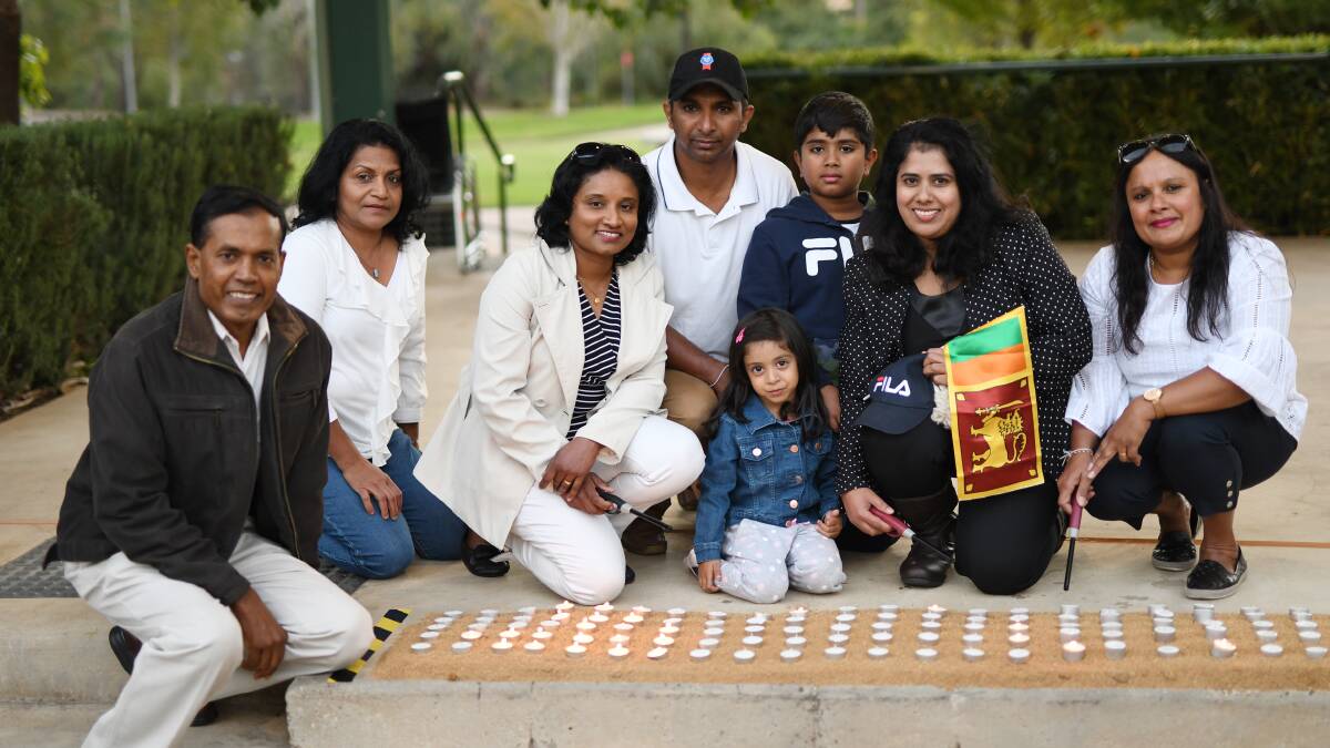 IN MEMORY: Chaminda Rathnayake (centre back), with family and other members of the Wagga Sri Lankan community, said he has not been able to sleep well since hearing about the bombings in Sri Lanka.