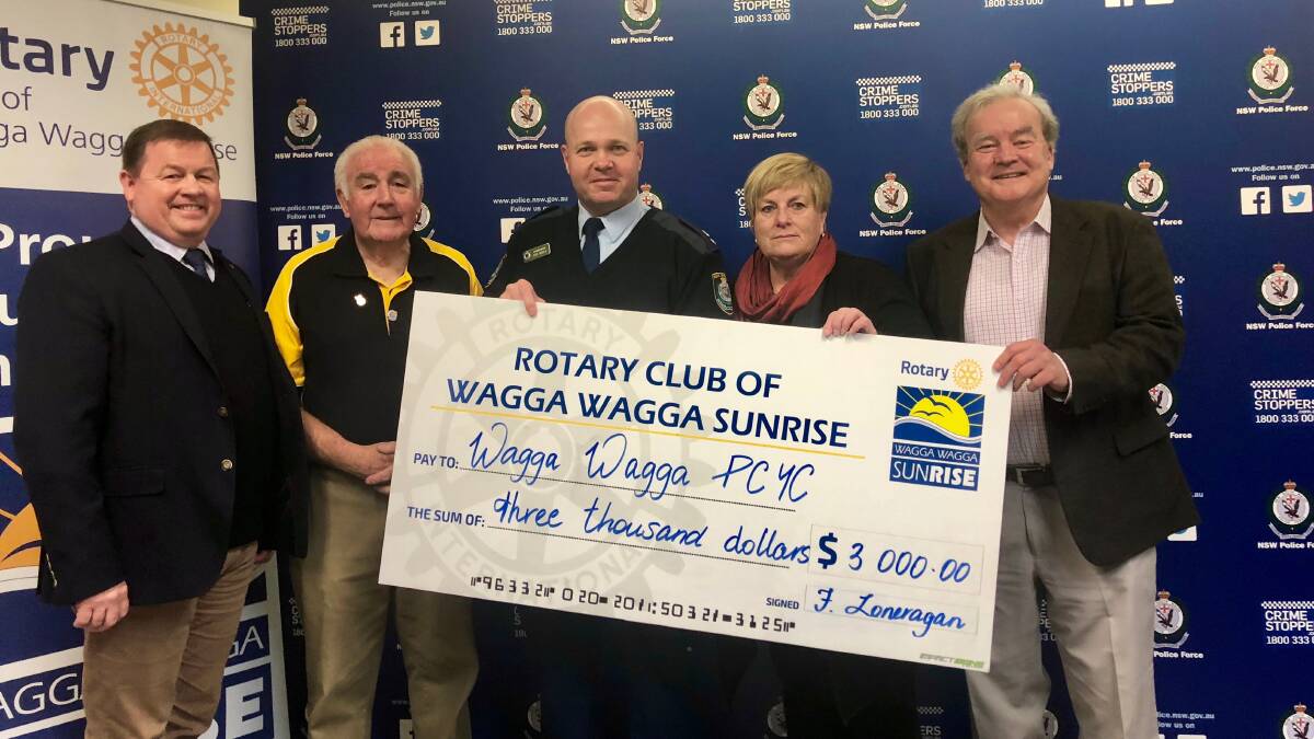 WORKING TOGETHER: Dominic Teakle (CEO of PCYC NSW), Fred Loneragan  (Rotary Wagga Sunrise president), Superintendent Bob Noble, Deidre Tome (former Rotary president) and Peter Gissing (Rotary member). Picture: Toby Vue