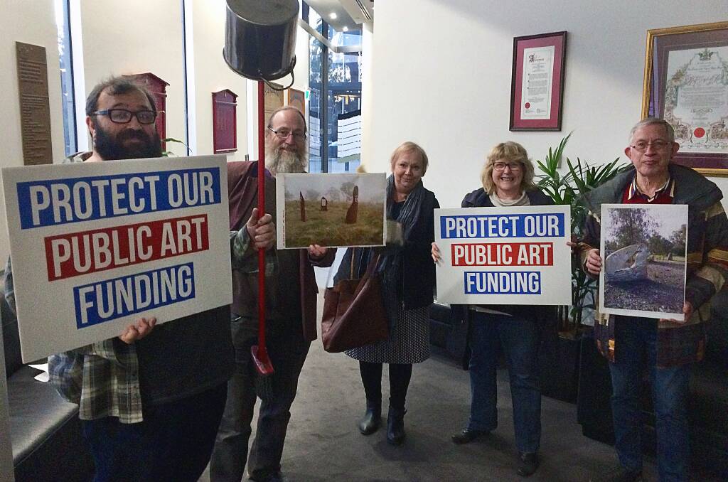 SAVE ART: Scott Howie and arts supporters protesting at an August council meeting.