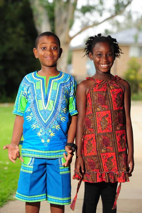 BELONGING: Wesley Laryea-Adjei, Year 6 and Tracy Tennie, Year 2, enjoy Harmony Day. Picture: Kieren L Tilly 
