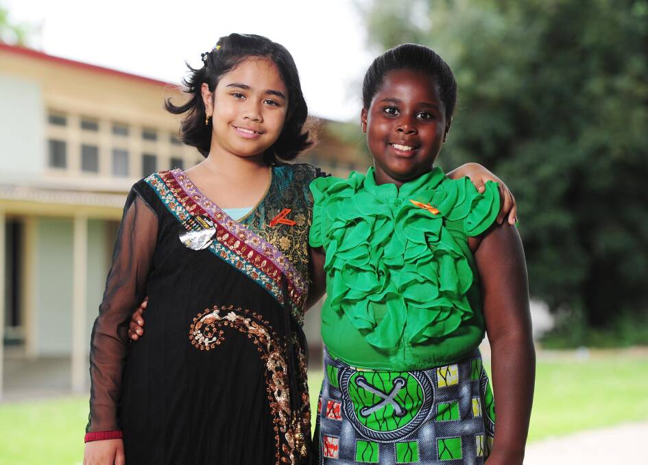 HARMONY DAY: Students Zaynab Quazi, Year 3, with Doreen Tuyisenge, Year 3. PIcture: Kieren L Tilly  