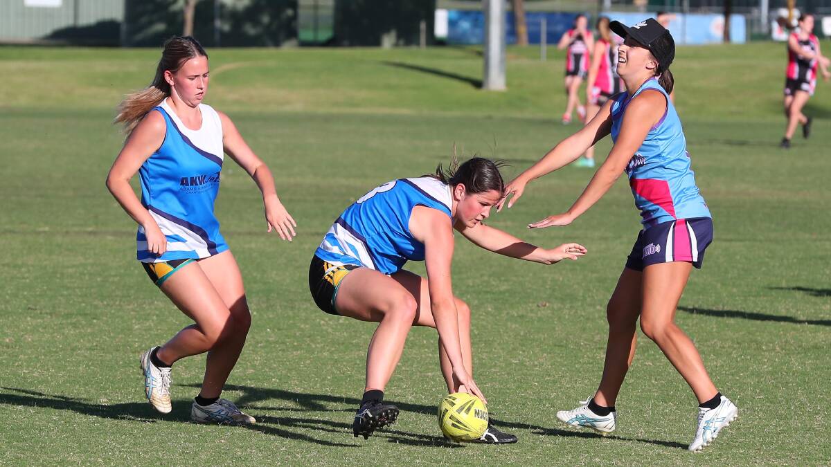 SLAMMING IT DOWN: Bella McDermott takes a touch for AKW Jets against Don Tuckwells Audio during round three of the Wagga Touch Association women's premier grade competition at Jubilee Park.
